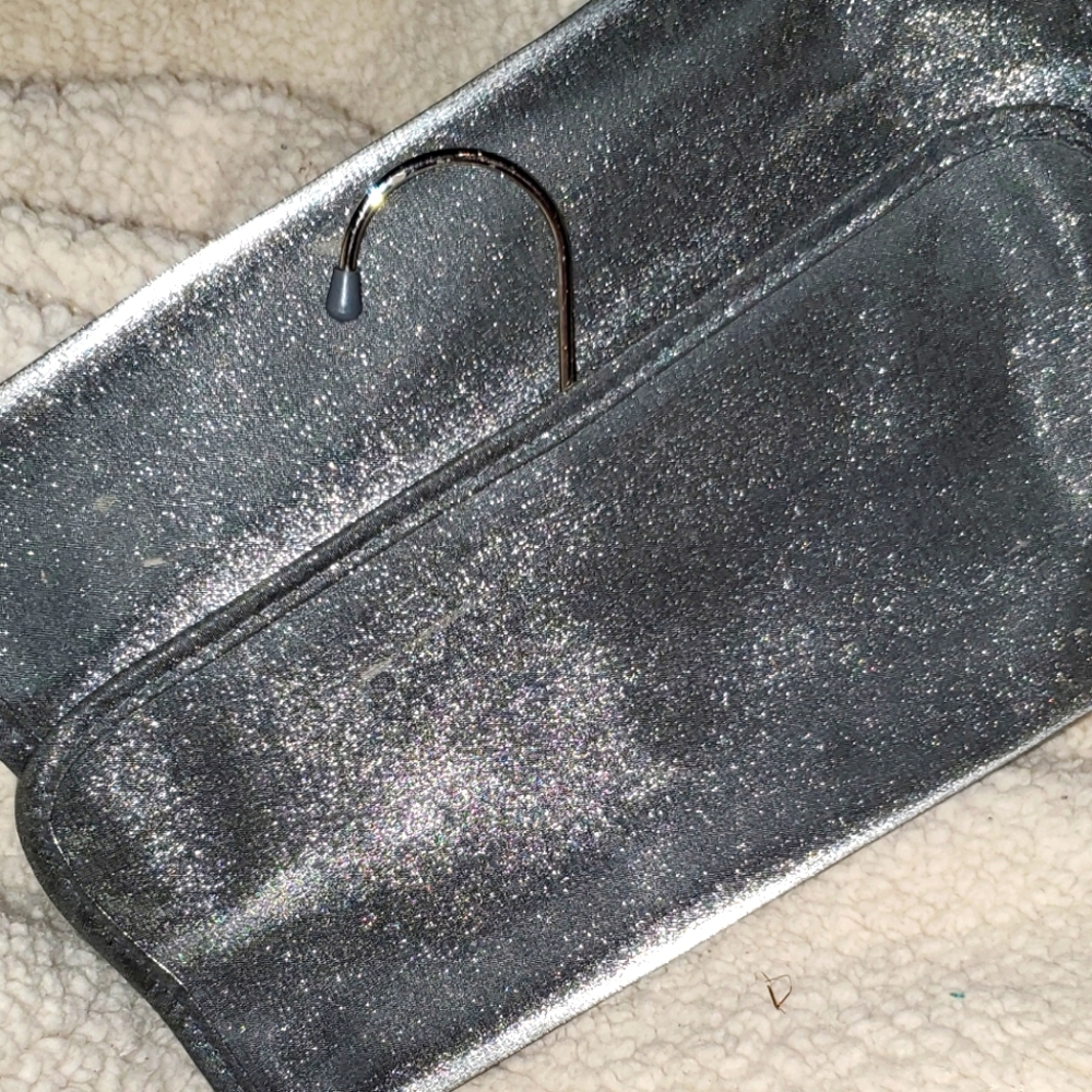 Shiseido hanging travel bag.  Pretty silver shimmer and functional.